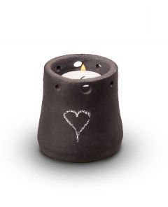 Miniurna cerámica con vela