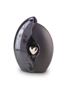 Ceramic funeral urn with silver heart